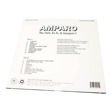 Back cover of COLD BUSTED Amparo vinyl record by The Deli, Es-K, and Jansport J showing the tracklist and credits.