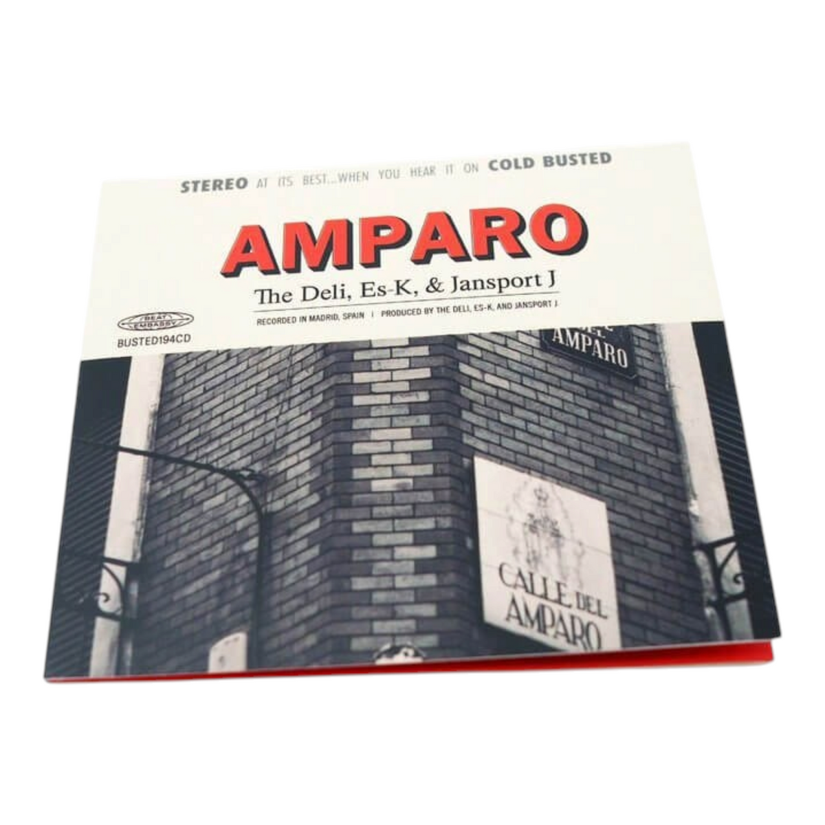 COLD BUSTED Amparo album compact disc featuring a black and white street photography cover of a Madrid building.